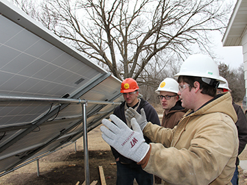 A photo of students working on solar panels.