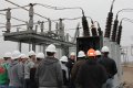 Students listening to instructor at the substation lab.